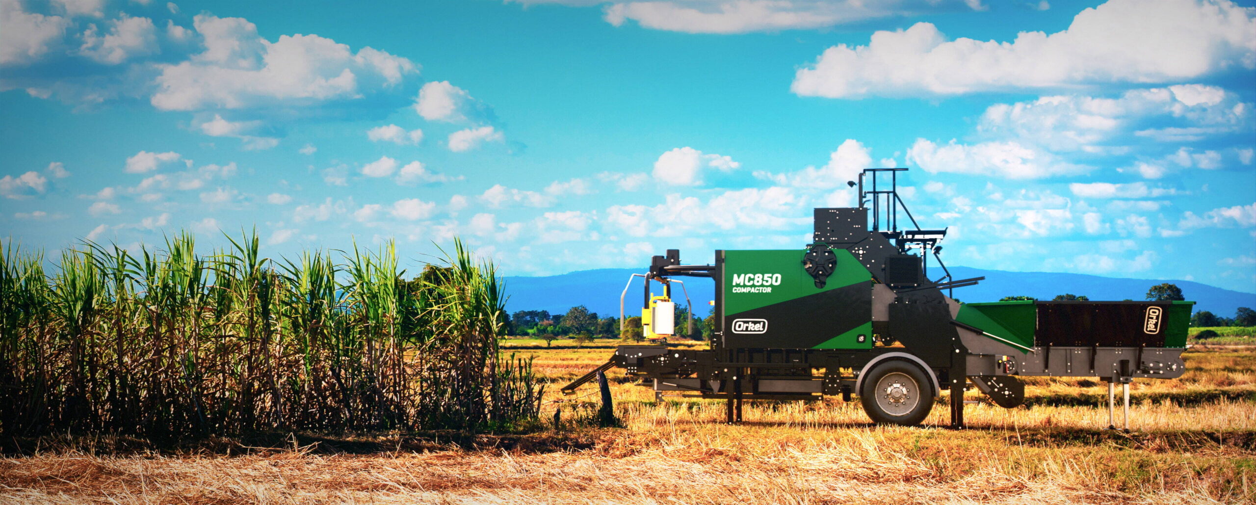 An MP850 compactor in a field, with brown grass flooring and blue skies.